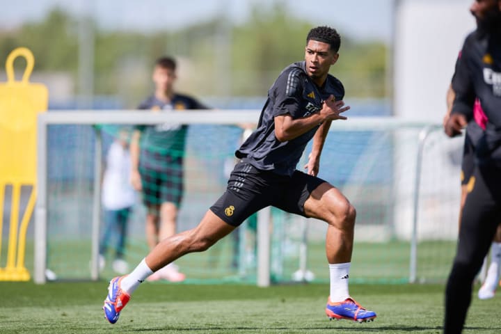 Jude Bellingham of Real Madrid CF warms up during a training...